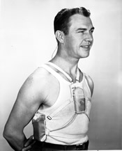 Picture of man with hearing device in a harness.