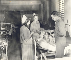 Dressing a brain wound, 21st General Hospital, Mirecourt, France, 1945