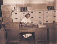 Mildred Trotter at her desk at Schofield Barracks