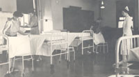 Student nurses practice making beds, 1940s